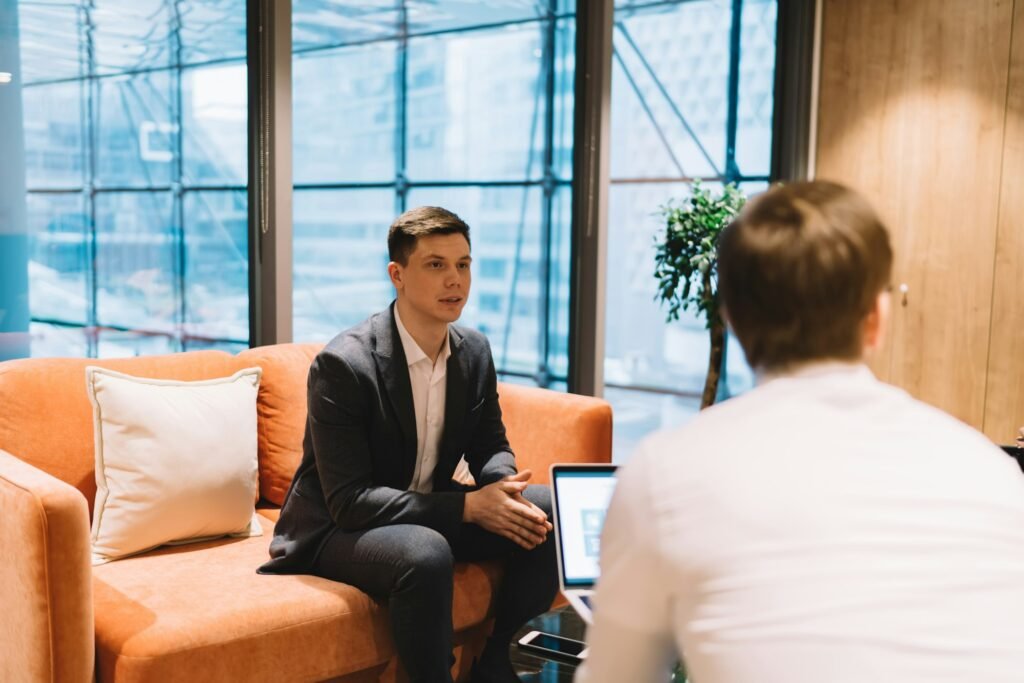 Candidate having interview with recruiter in modern workplace